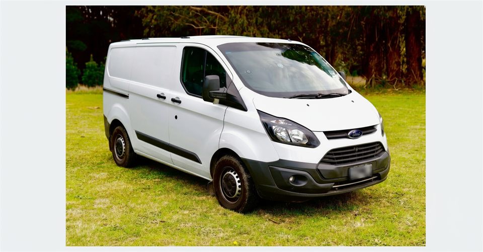 White Ford Transit delivery van