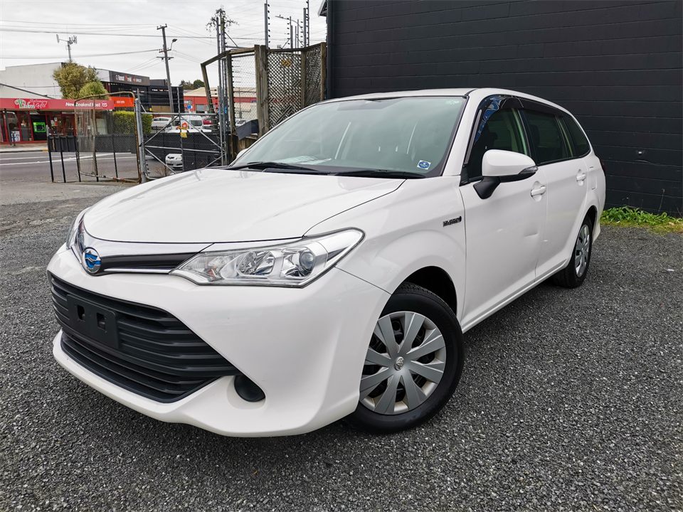 White Toyota Fielder station wagon